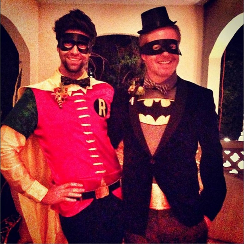 Jesse Tyler Ferguson as "Batman" and husband Justin Mikita as "Robin"