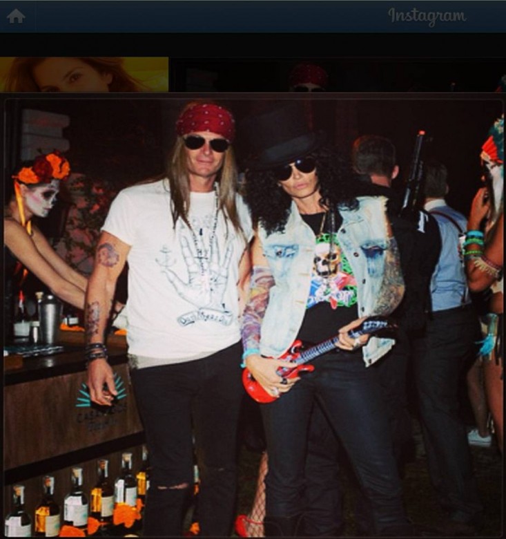 Rande Gerber as "Axl Rose" and Cindy Crawford as "Slash" from Guns n' Roses.